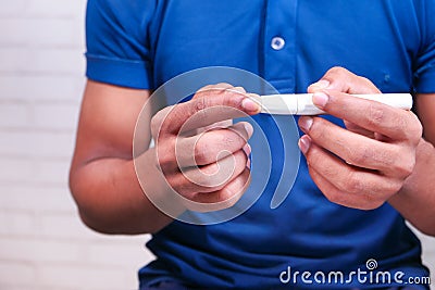 man's hand measure glucose level to check the sugar level Stock Photo