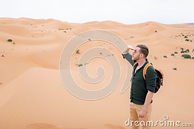 Young man in Sahara desert. Stock Photo