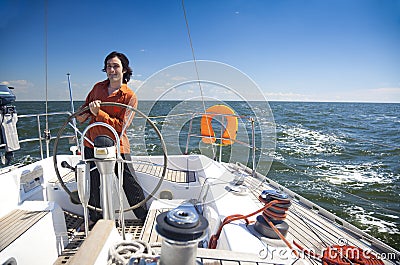 Young Man is Sailboat Captain Stock Photo