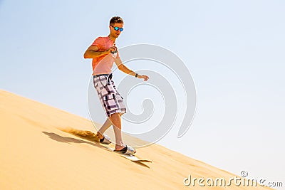 Young man sand boarding Stock Photo