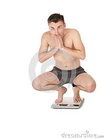 Young man on scale Stock Photo