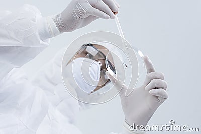 Young man scientist or laboratory worker holding a Petri dish Stock Photo