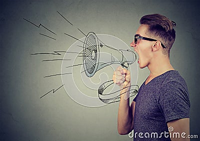 Man screaming in a megaphone making announcement Stock Photo