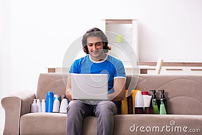 Young man selling cosmetics via internet Stock Photo