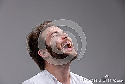 Young man with a sense of humour enjoying a laugh Stock Photo