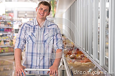 Young man shopping for pre-pack in a grocery store Stock Photo