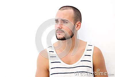 Young man with short hair and beard looking away Stock Photo