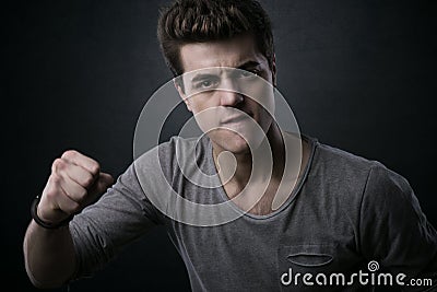 Young man showing fists Stock Photo