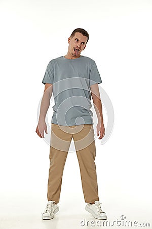 young man shows her toung, feels disgust Stock Photo