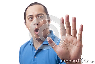 Young Man Shows Stop Sign Stock Photo