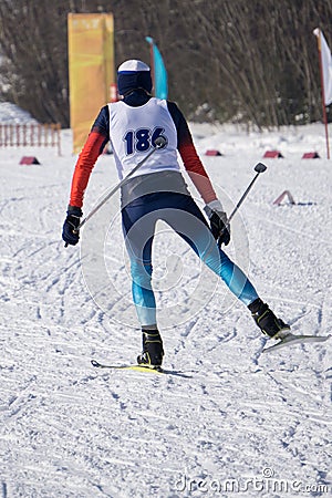 Young man skier running downhill in powder snow, Alpine mountains. Winter sport and recreation, leisure outdoor activities Editorial Stock Photo