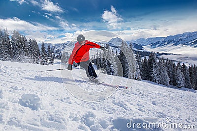 Young man skiing in Kitzbuehel ski resort in Tyrolian Alps, Austria Stock Photo