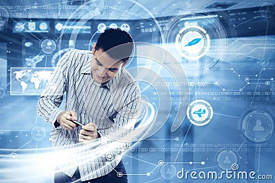 Young man with smartphone and futuristic screen Stock Photo