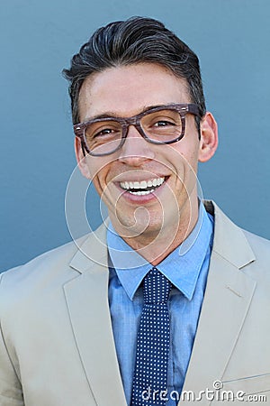 Young man smiling and looking at camera wearing glasses. Portrait of a happy handsome young man wearing spectacles Stock Photo