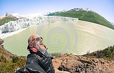 Young man solo traveler taking selfie at Perito Moreno glaciar Stock Photo