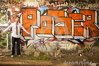 Young Man Standing by Sign Editorial Stock Photo