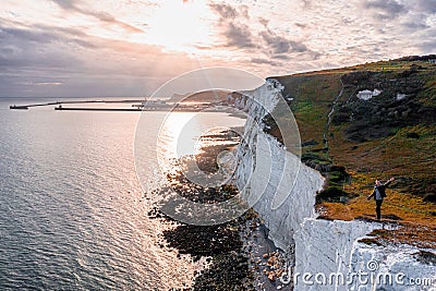 Young man standing on top of the White Cliffs of Dover. Editorial Stock Photo