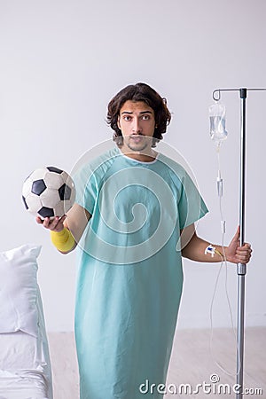 Young man staying in hospital in transfusion concept Stock Photo