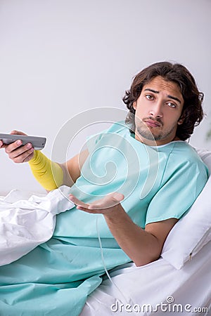 Young man staying in hospital in transfusion concept Stock Photo