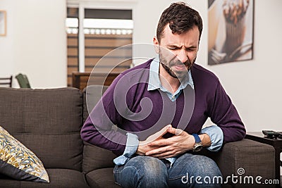 Young man with a stomach ache Stock Photo