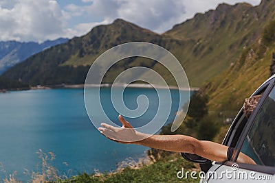 Young man stopped his car for enjoying the astonishing view and enjoy freedom Stock Photo