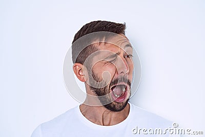 Young man suffering from Tourette syndrome or TS. Face nerve disorders Stock Photo
