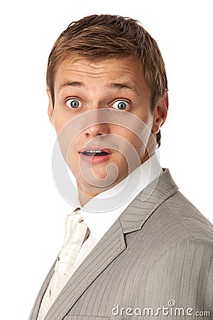 Young man in a suit looking very shocked Stock Photo