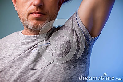 Young man with sweat under the armpit and have a foul odor. Health and medicine concept Stock Photo