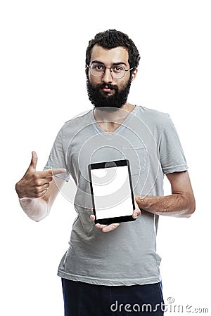 A young man with a tablet shows on an isolated screen. Space for text. White background. Vertical. Mockup Stock Photo