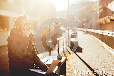 Man, taking phone calls and working from urban alley during autumn Stock Photo