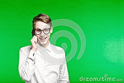 Young man talking by phone and smiliing Stock Photo