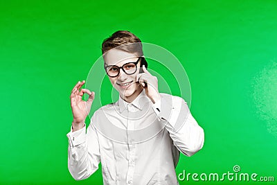 Young man talking by phone and smiliing Stock Photo