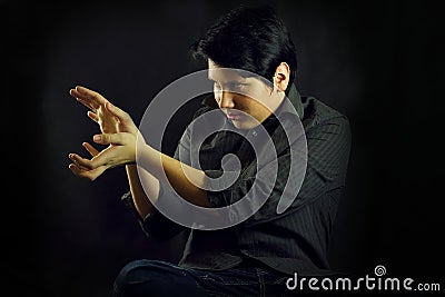 Young man teenager portrait hands focusing Stock Photo