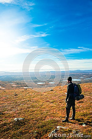 Young man at the top looking out over the view Stock Photo