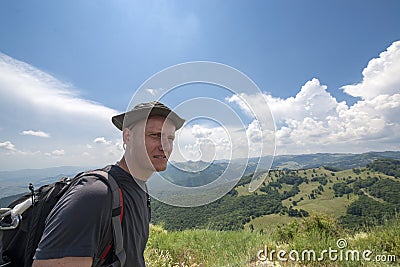 Young man on top of the mountain Stock Photo