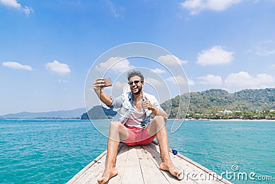 Young Man Tourist Sail Long Tail Thailand Boat Speak Take Selfie Photo On Cell Smart Phone Stock Photo