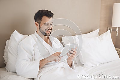 Young man traveler tourist hotel room accomodation Stock Photo