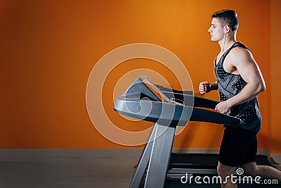 Young man on the treadmill Stock Photo