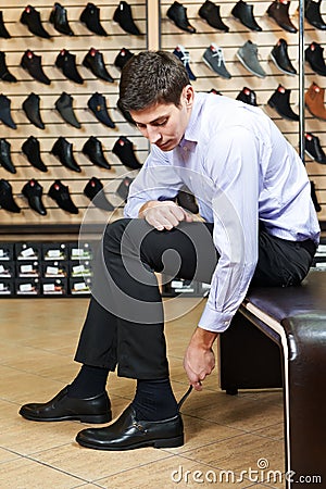 Young man trying on shoes Stock Photo