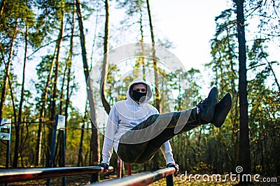 Young man Trying To Do Sport During Coronavirus Crises Despairing Of The World Stock Photo