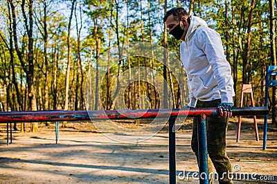 Young man Trying To Do Sport During Coronavirus Crises Despairing Of The World Stock Photo