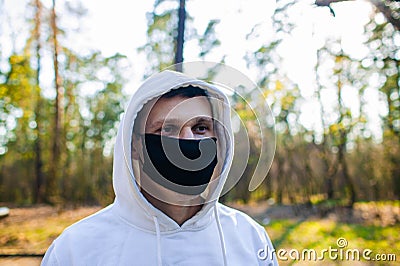 Young man Trying To Do Sport During Coronavirus Crises Despairing Of The World Stock Photo