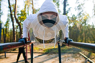 Young man Trying To Do Sport During Coronavirus Crises Despairing Of The World Stock Photo