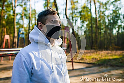 Young man Trying To Do Sport During Coronavirus Crises Despairing Of The World Stock Photo