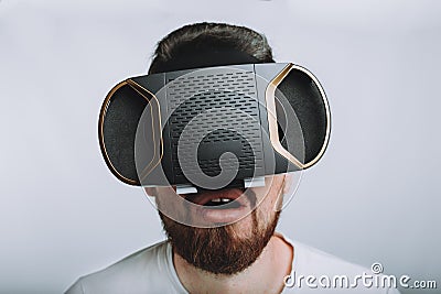 Young man trying vr goggles. Isolated on white background Stock Photo