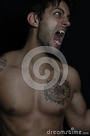 Young man turning into werewolf Stock Photo