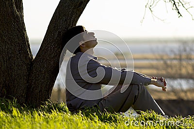 Young man turns to God with hope, the concept of faith and spirituality Stock Photo
