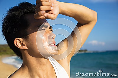 Young man under hot summer heat wave Stock Photo