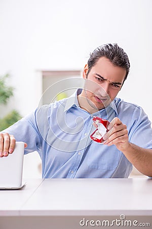 Young man in unrequited love concept Stock Photo