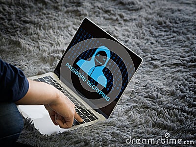 Young man use his finger press enter key on laptop computer keyboard, password decrypting displayed on the screen Stock Photo